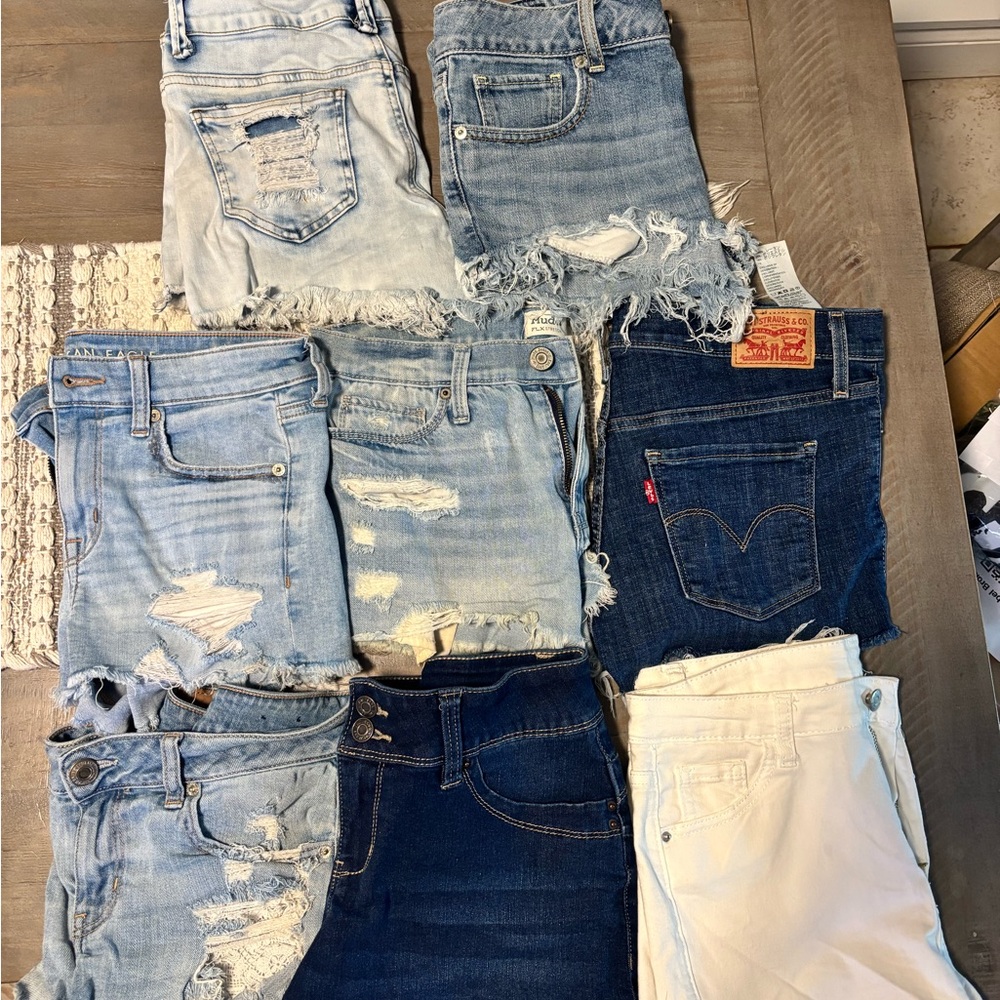 Collection of denim shorts (8 pair, mostly distressed and size 7; Levis, AE, et)